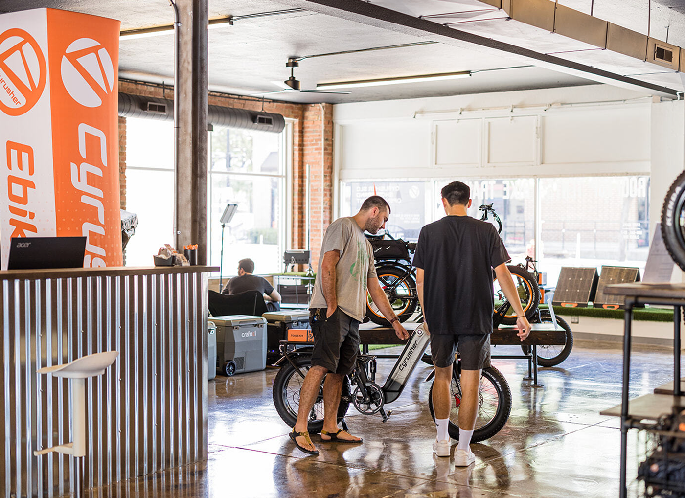 Customers talking with the Cyrusher SLC team in the showroom